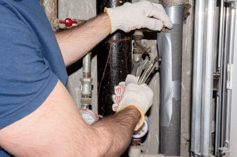 Plumber sealing a pipe joint